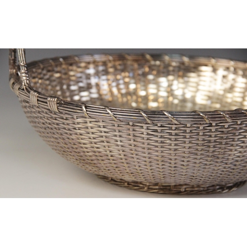 118 - A Christofle silver plated bread bowl, in the form of a circular weaved basket with loop handle, 29c... 