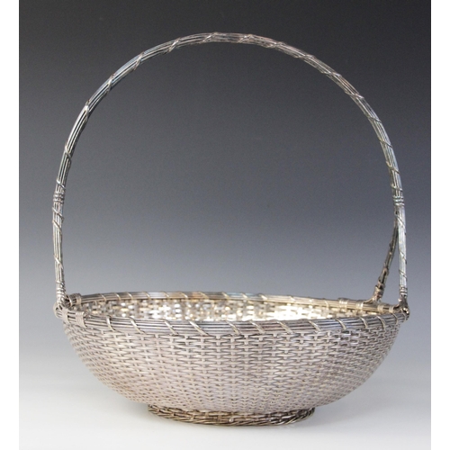 118 - A Christofle silver plated bread bowl, in the form of a circular weaved basket with loop handle, 29c... 