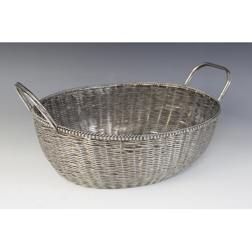 118 - A Christofle silver plated bread bowl, in the form of a circular weaved basket with loop handle, 29c... 