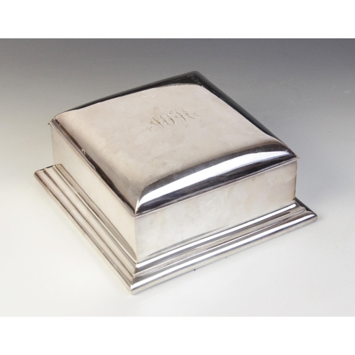 123 - An early 20th century silver plated jewellery casket, of square form on stepped base, monogrammed in... 