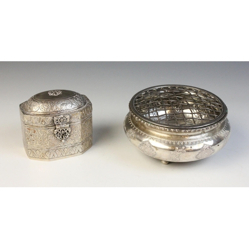 17 - A silver coloured tea caddy, of faceted form with hinged cover and catch, elaborated engraved with s... 