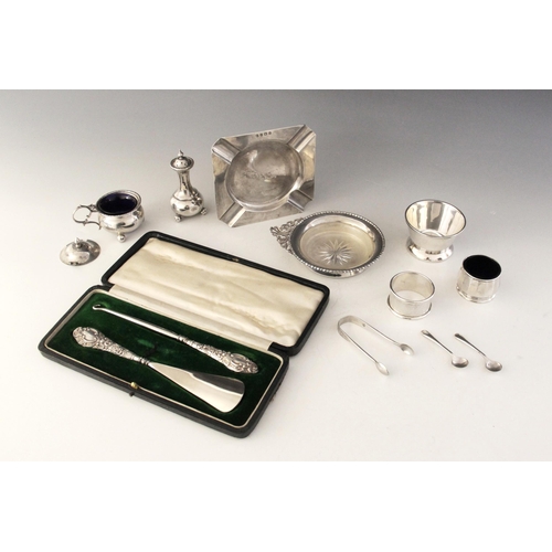 37 - A selection of a silver and silver coloured tableware, to include an Edwardian silver ashtray, A & J... 