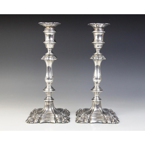 66 - A pair of George V silver mounted candlesticks, Ellis Jacob Greenberg, London 1926, each on shaped w... 