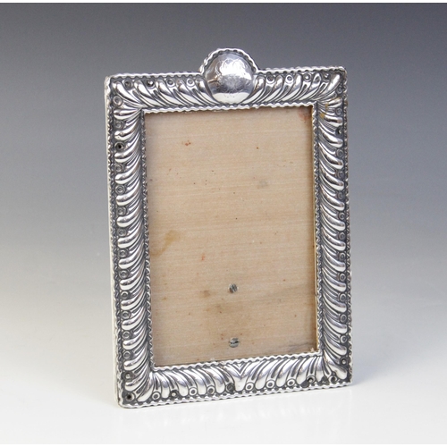 68 - A Victorian silver mounted photograph frame, William Comyns, London 1897, of rectangular form with s... 