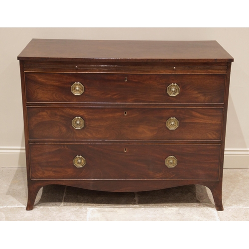 687 - An early 19th century mahogany chest of drawers, the rectangular top above a brushing slide and thre... 