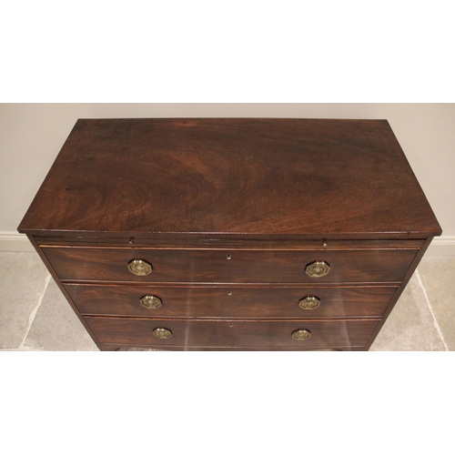 687 - An early 19th century mahogany chest of drawers, the rectangular top above a brushing slide and thre... 