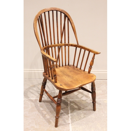 697 - A 19th century ash, elm and beech wood Windsor farmhouse elbow chair, stamped 'J W Webb', the hooped... 