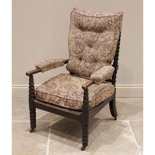 705 - A 19th century ebonised bobbin turned armchair, with later padded back rest and arm rests, the bobbi... 