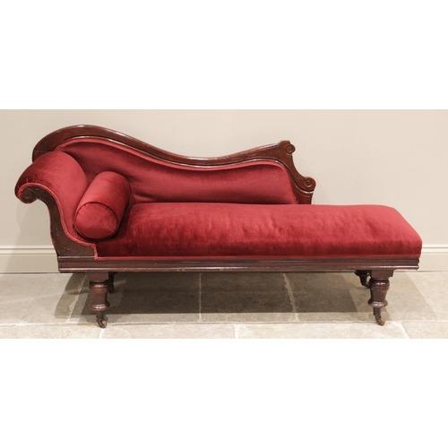 706 - A late Victorian walnut framed chaise lounge, the shaped back carved with scrolled terminals extendi... 