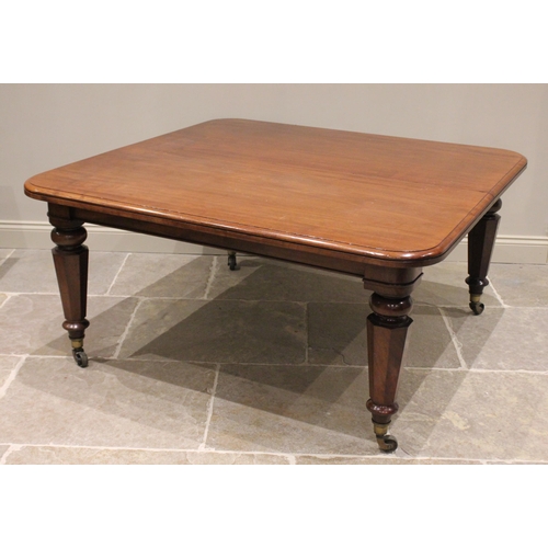 714 - A Victorian mahogany extending dining table, the rectangular top with rounded corners and a moulded ... 