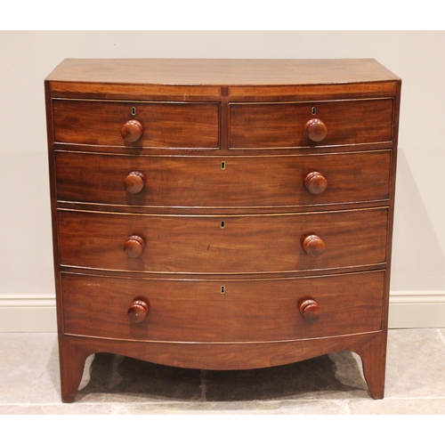 715 - An early 19th century mahogany bowfront chest of drawers, formed from two short over three long grad... 