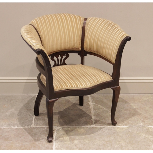 720 - An Edwardian mahogany tub chair, upholstered in striped velour fabric, the curved back extending to ... 