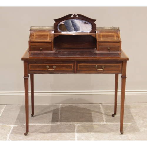 721 - An Edwardian mahogany and satinwood cross banded bonheur de jour, in the manner of Edwards & Roberts... 