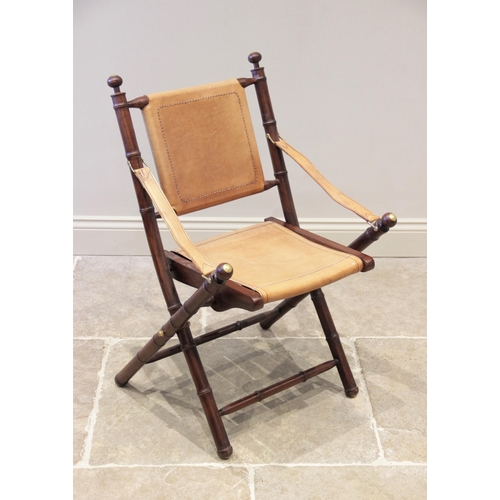 736 - A hardwood and tan leather folding directors chair, late 20th century, the simulated bamboo frame wi... 