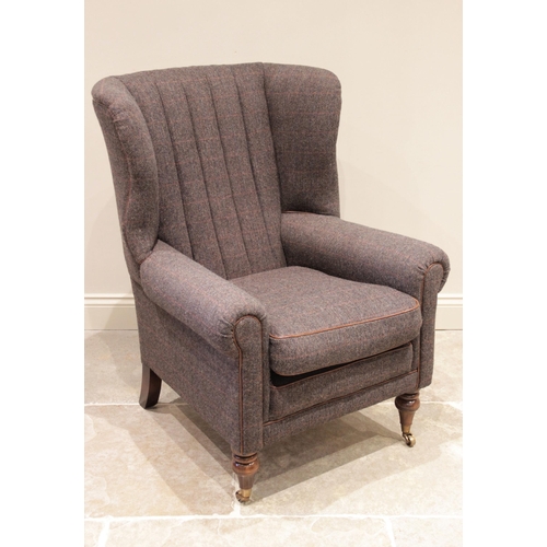 739 - A 'Harris Tweed' wing back fireside armchair, late 20th century, the scalloped padded back rest encl... 