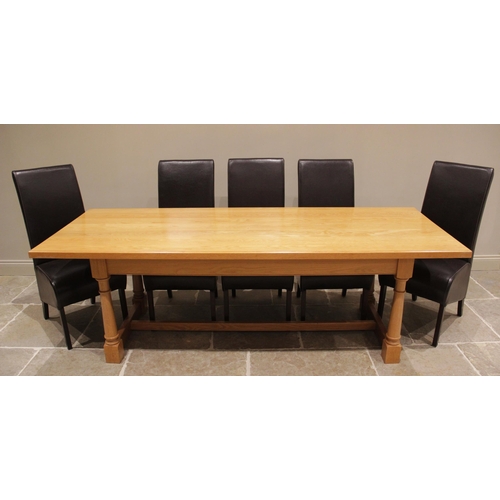 747 - A contemporary light oak refectory style boardroom table and eight chairs, late 20th/early 21st cent... 