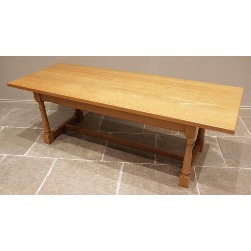 747 - A contemporary light oak refectory style boardroom table and eight chairs, late 20th/early 21st cent... 