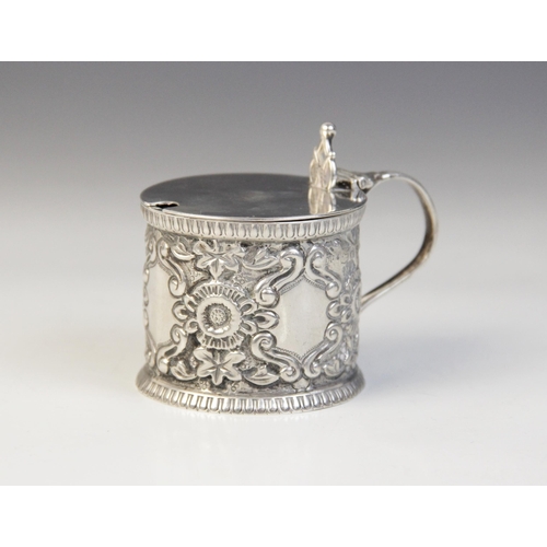 79 - A Victorian silver wet mustard, Josiah Williams & Co, London 1893, of drum form with repoussé floral... 