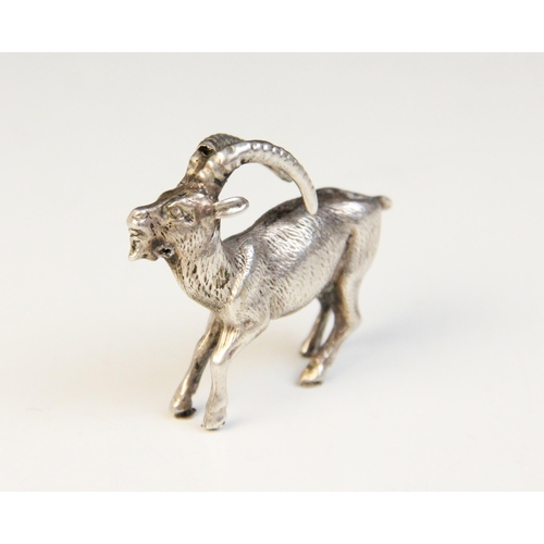 86 - A silver coloured model of an Ibex goat, in the manner of Patrick Mavros, with realistic fur effect ... 