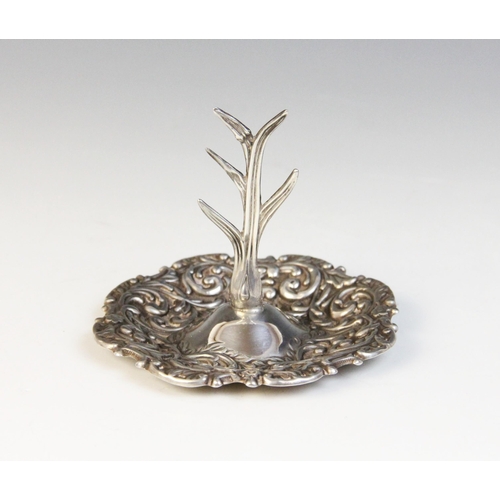 89 - An Edwardian silver ring tree, Henry Matthews, Birmingham 1905, the circular base with shaped border... 