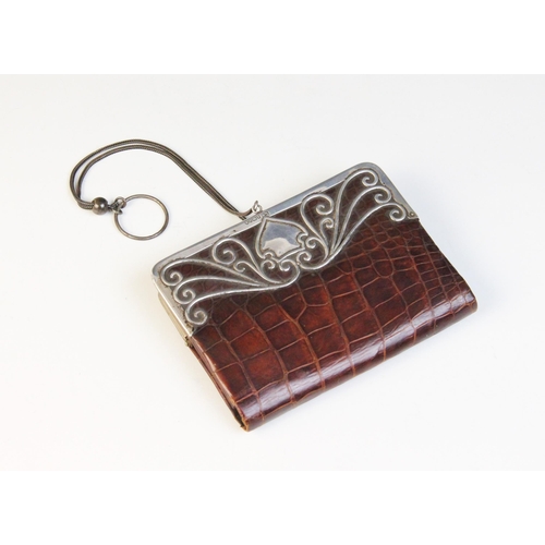 98 - An Edwardian continental silver mounted crocodile evening purse, import marks for 'L.K', Birmingham ... 