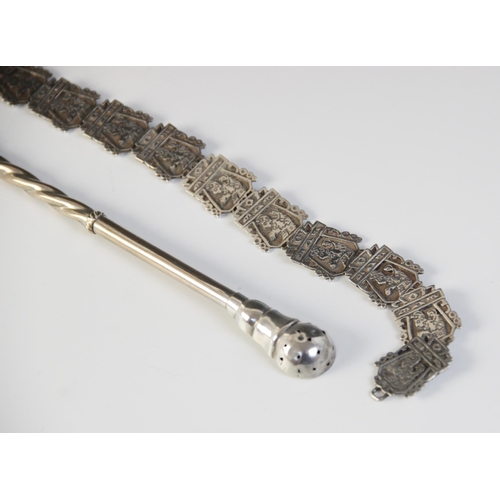 7 - An Asian silver coloured belt, comprising cast links, each designed as a figure in an architectural ... 
