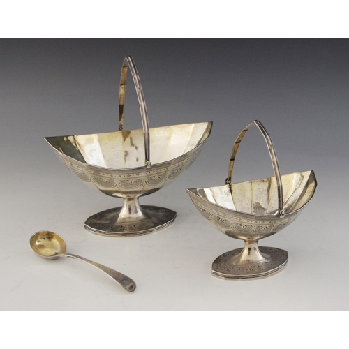 4 - Two George III silver swing-handled sugar baskets, Charles Hougham, London 1790, the faceted navette... 
