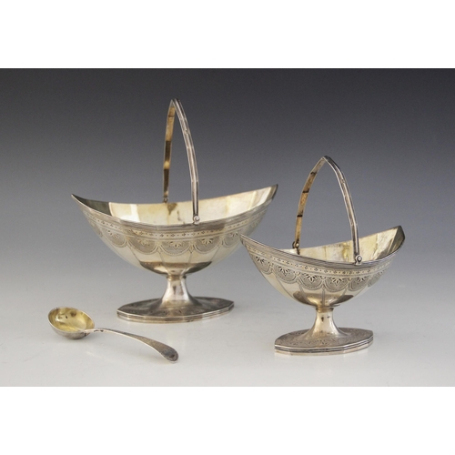 4 - Two George III silver swing-handled sugar baskets, Charles Hougham, London 1790, the faceted navette... 