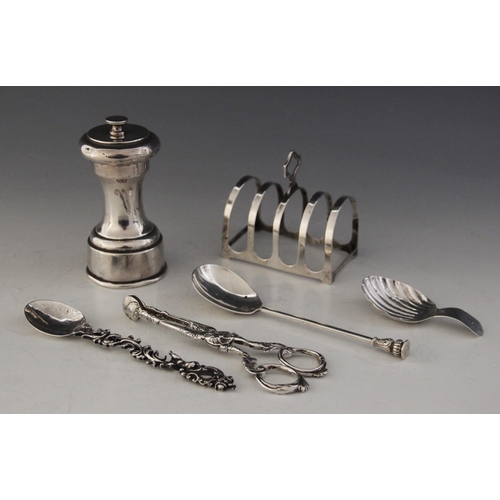 50 - A selection of silver tableware, to include; a George V silver four-division toast rack, Reid & Sons... 