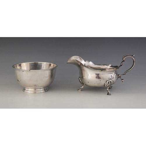 52 - A George V silver sauce boat by E S Barnsley & Co, Birmingham 1918, of bellied form with shaped bord... 