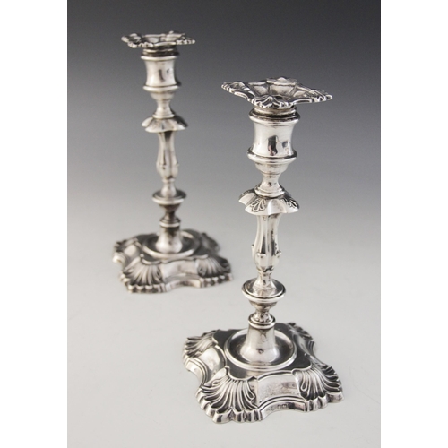 53 - A pair of George V silver candlesticks by William & Hutton & Sons, Birmingham 1912, with waisted kno... 