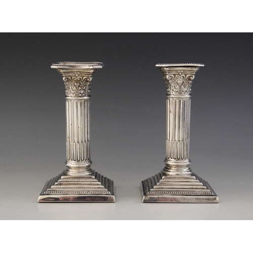 54 - A pair of Edwardian silver candlesticks, Charles Westwood & Sons, Birmingham 1907, Corinthian column... 