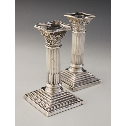 54 - A pair of Edwardian silver candlesticks, Charles Westwood & Sons, Birmingham 1907, Corinthian column... 