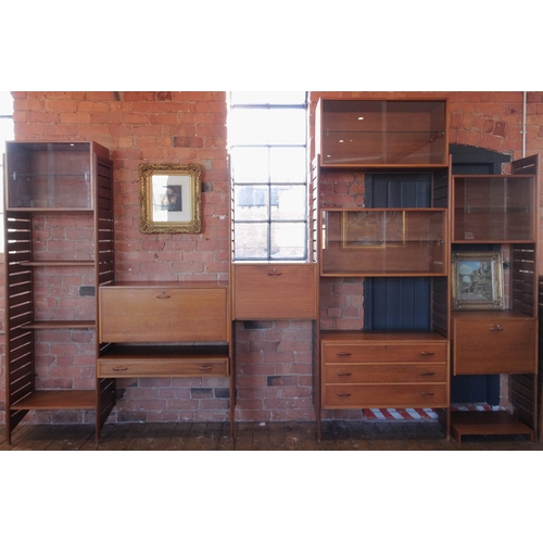 745 - A 1960's/70's Staples teak Ladderax wall unit, comprising; seven ladder racks, four glazed cabinets,... 