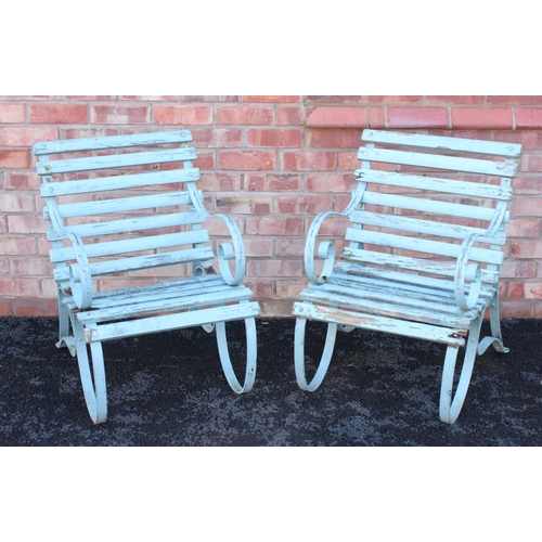 752 - A pair of painted iron and hardwood garden/patio chairs, early 20th century, the slatted chairs rais... 