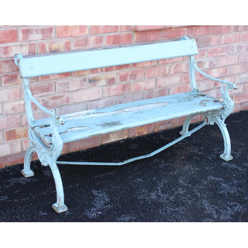 753 - A painted iron and hardwood garden bench, late 19th century, the 'X' frame bench ends cast with a wi... 