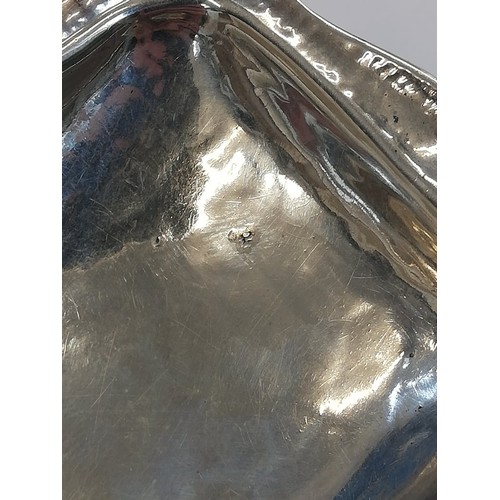 6 - A George V silver pin dish, Omar Ramsden, London 1922, of rectangular form with shaped borders on fo... 