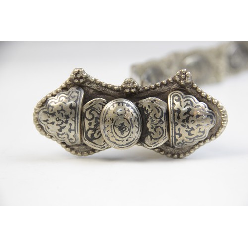 85 - An Armenian silver coloured niello belt, each link designed as an oval panel decorated in niello wit... 