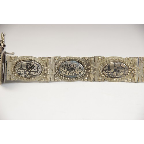 85 - An Armenian silver coloured niello belt, each link designed as an oval panel decorated in niello wit... 