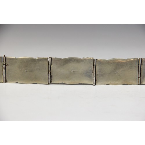 85 - An Armenian silver coloured niello belt, each link designed as an oval panel decorated in niello wit... 