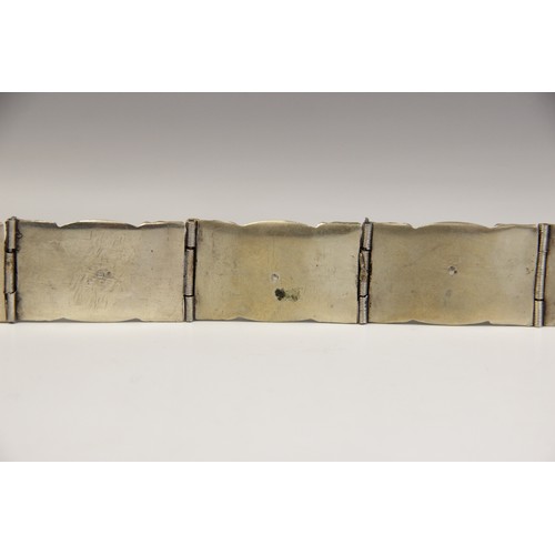 85 - An Armenian silver coloured niello belt, each link designed as an oval panel decorated in niello wit... 