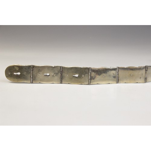 85 - An Armenian silver coloured niello belt, each link designed as an oval panel decorated in niello wit... 