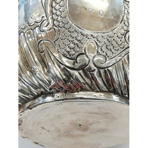 3 - A Queen Anne silver porringer, John Cory, London, 1705, of typical form with half fluted body, rope ... 