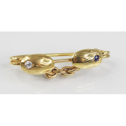 109 - A Victorian diamond and sapphire brooch, probably converted from a cufflink, designed as two oval pa... 