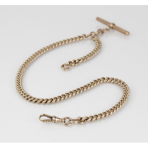 113 - A Victorian gold coloured watch chain, designed as a graduated curb link chain with lobster claw fas... 