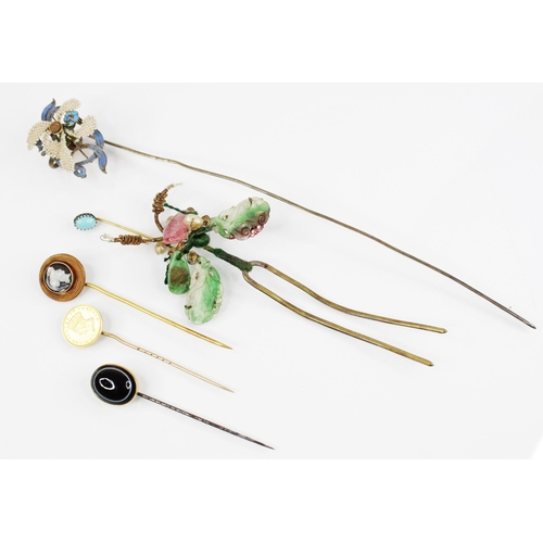 115 - A selection of stick pins and accessories, to include a carved hardstone cameo stick pin, depicting ... 