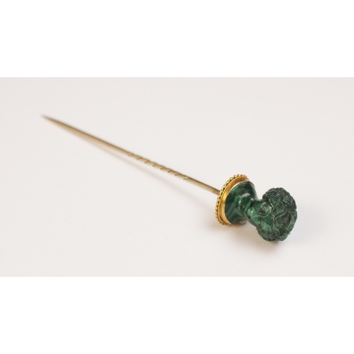 116 - A malachite stick pin, carved in the classical style as a female head with waved hair and a crown of... 