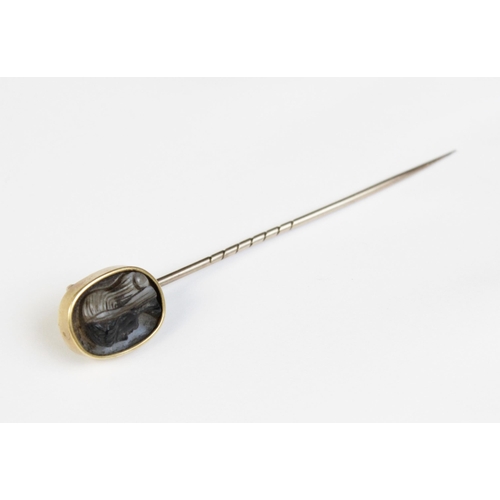 117 - A 19th century carved hardstone cameo set stick pin, the oval shaped cameo carved with the profile o... 