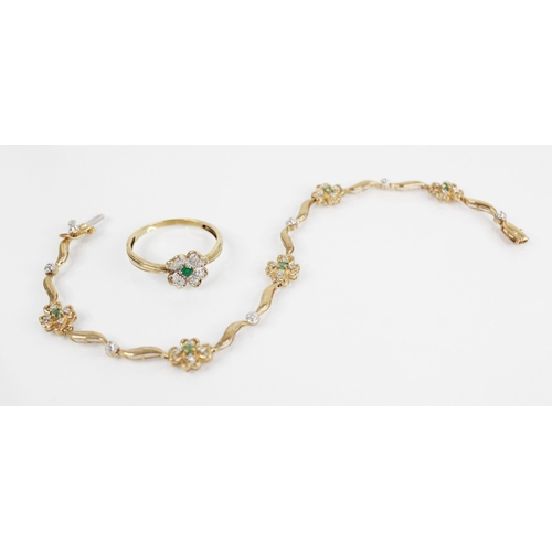 123 - An emerald and diamond 9ct gold bracelet, the scrolling link bracelet interspersed by five four-leaf... 