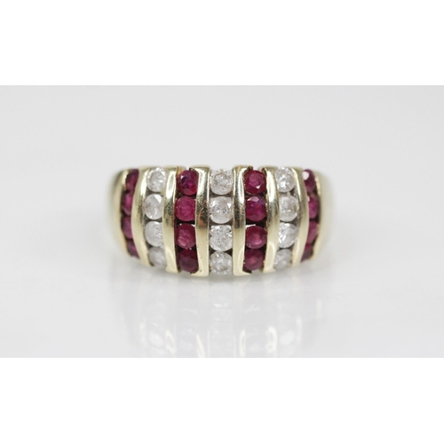 124 - A ruby and diamond 9ct gold bombe ring, the head designed as alternating rows of brilliant cut diamo... 